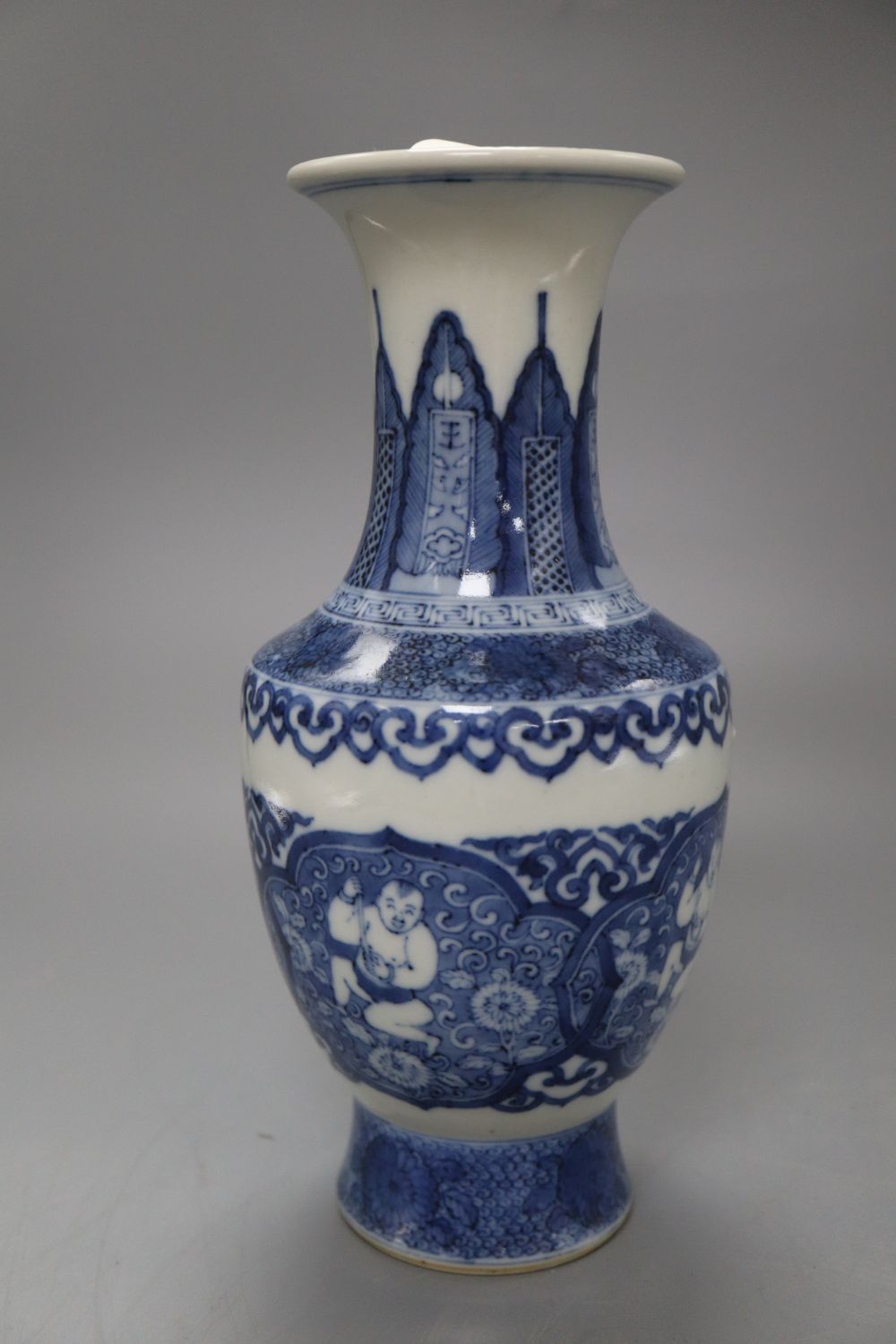 A Chinese blue and white bottle vase, bears Kangxi mark, height 22cm